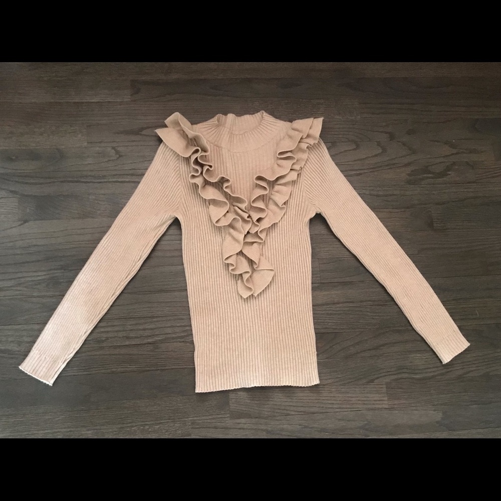 Stretchy sweater with ruffle detail